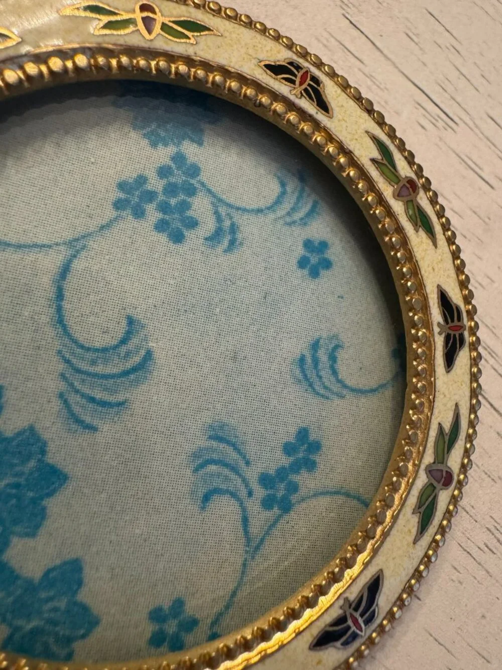 Vintage enamel picture frame with butterfly and floral theme